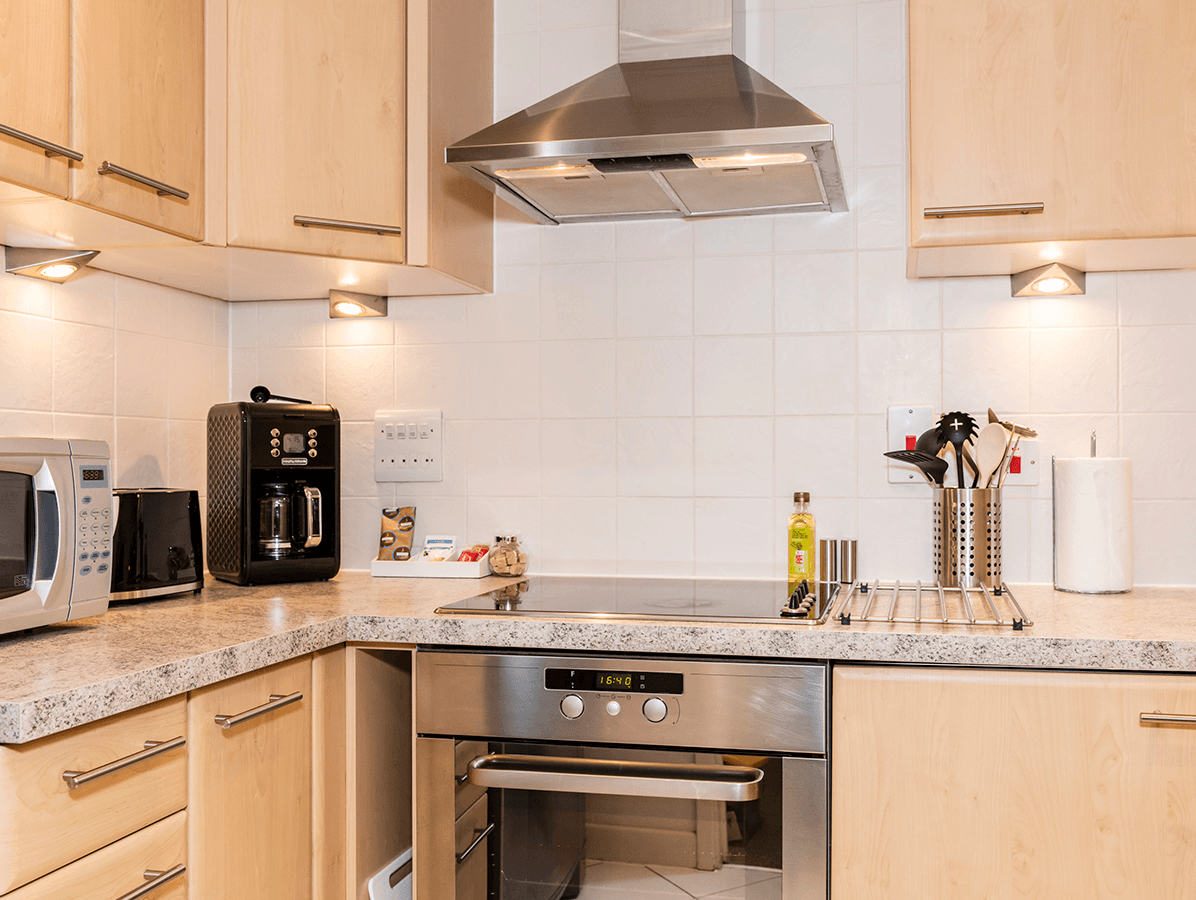 Fully fitted contemporary kitchen with integrated appliances and extractor fan at The Daisy Suite, Centrium, Woking Fully fitted contemporary kitchen with integrated appliances and extractor fan at The Daisy Suite, Centrium, Woking
