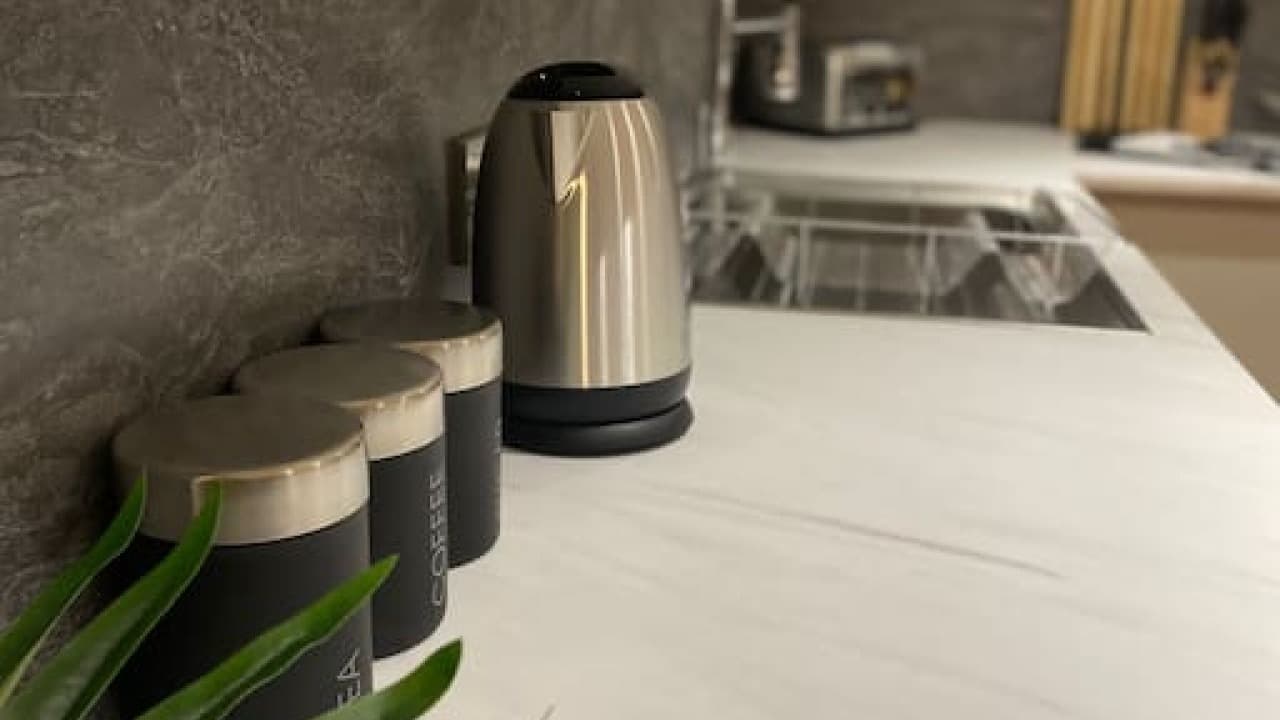 Kitchen countertop with sleek jug kettle and trio of canisters in modern setting – De Parys Flat 4, Bedford Kitchen countertop with sleek jug kettle and trio of canisters in modern setting – De Parys Flat 4, Bedford
